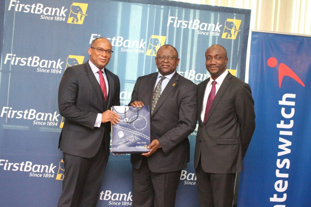 L-R: Mitchell Elegbe, Group Managing Director/CEO, Interswitch;  Dr. Adesola Adeduntan, Managing Director/CEO, FirstBank (Nigeria)  and Mr. Charles Ifedi, Divisional CEO, Consumer Segments, Interswitch, during the official recognition of FirstBank 100 million transactions milestone by Interswitch at FirstBank Headquarters in Lagos recently.