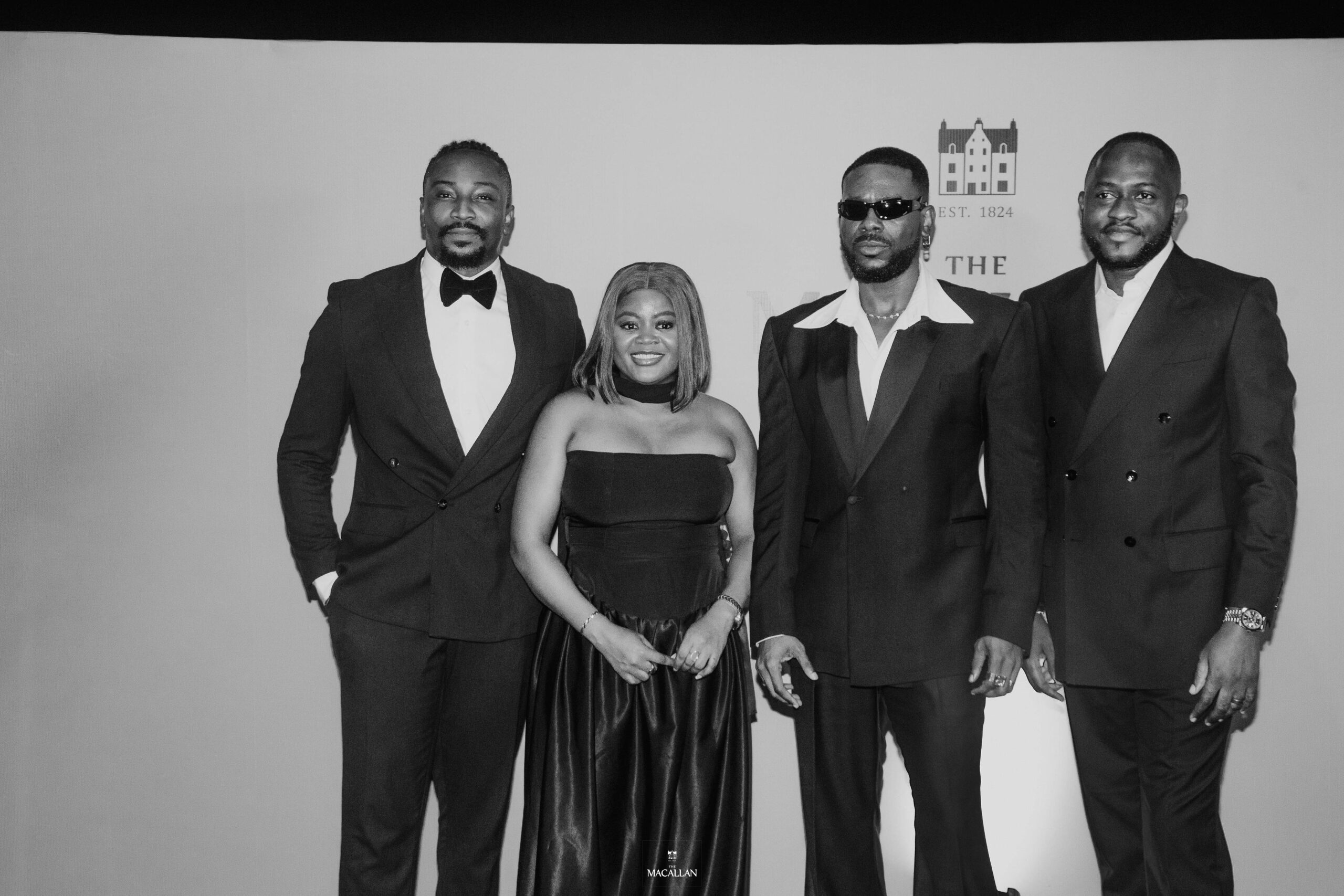 L-R: Daniel 'Sir Dee' Atteh, The Macallan ambassador, Lagos; Idorenyin Emmanson, Assistant Brand Manager, Edrington Portfolio, Nigeria; Adekunle Gold and Hammed Adebiyi, Senior Brand Manager, Nigeria - Edrington Portfolio at an exclusive dinner event held in honour of Adekunle Gold in Lagos.