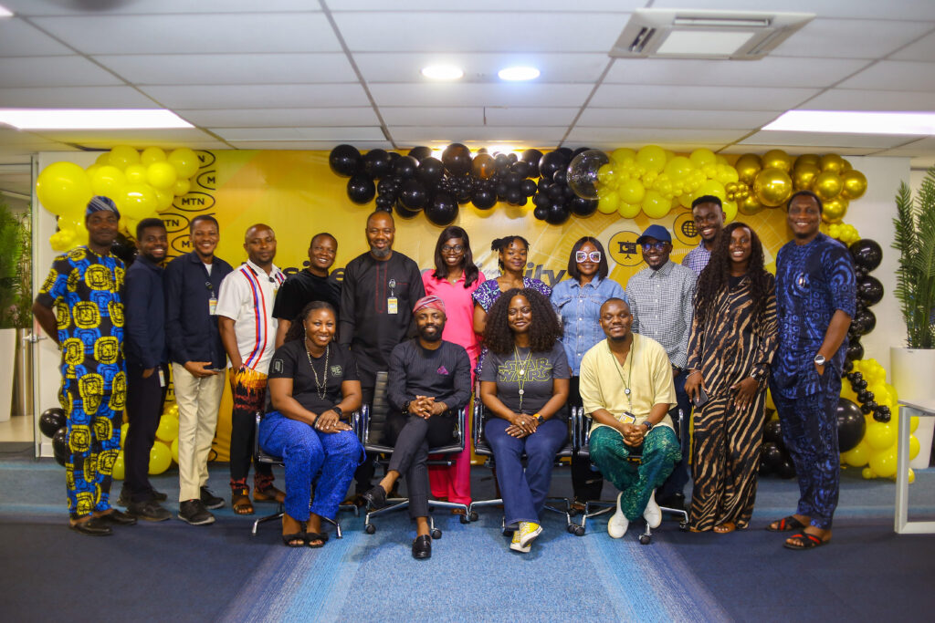 A’isha Umar Mumuni, Chief Digital Officer, MTN Nigeria (seated middle), flanked by MTN MIP Alumni and MTNers.